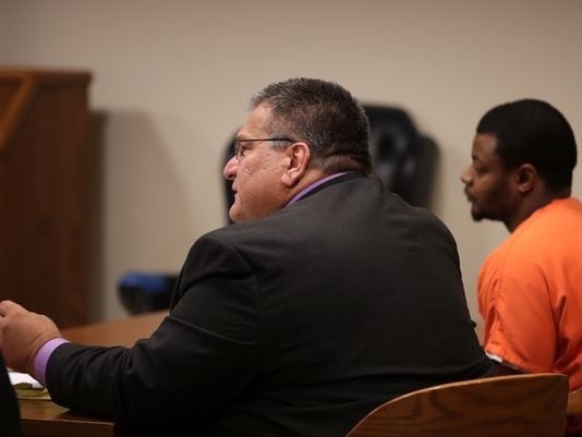 Photo of Paul A. Ksicinski in court with client Henry Nellem
